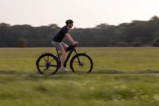 Man riding an e-bike through the countryside