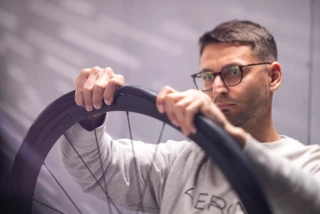 A person inspects a bicycle tire