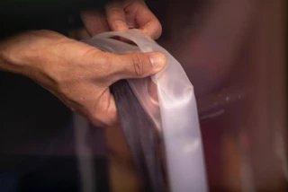 Person holding several bicycle inner tubes