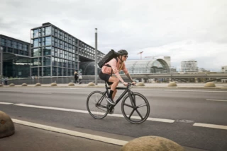 Woman rides through Berlin on a City Bike